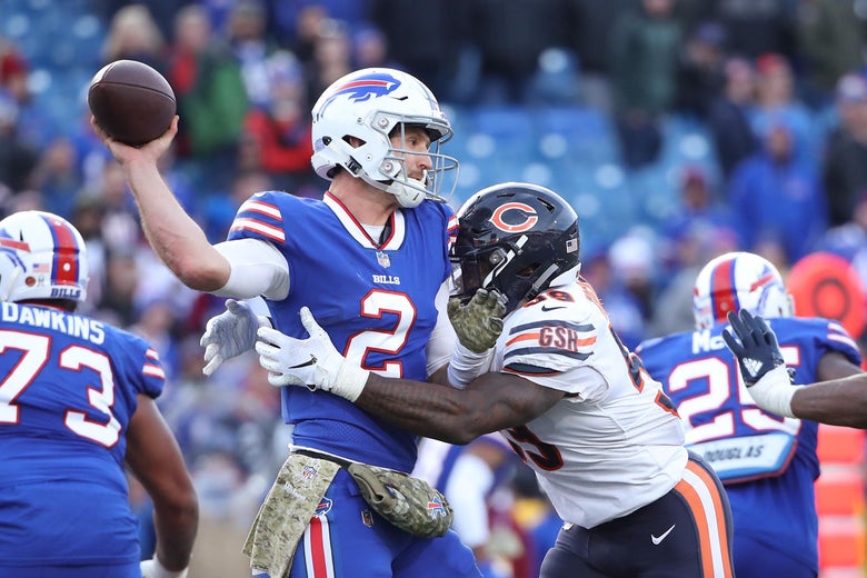 BUFFALO, NY - NOVEMBER 04: Nathan Peterman #2 of the Buffalo Bills is hit as he throws by Danny Trevathan #59 of the Chicago Bears in the fourth quarter during NFL game action at New Era Field on November 4, 2018 in Buffalo, New York. (Photo by Tom Szczerbowski/Getty Images)